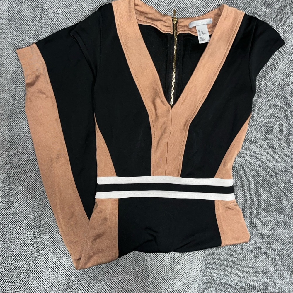 H&M black and tan jumpsuit with zipper
detail